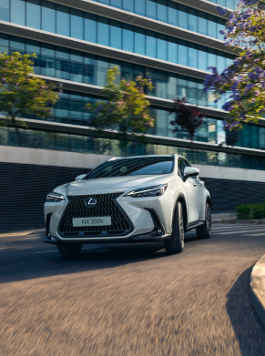 Silver Lexus NX 350h car driving on an urban road.