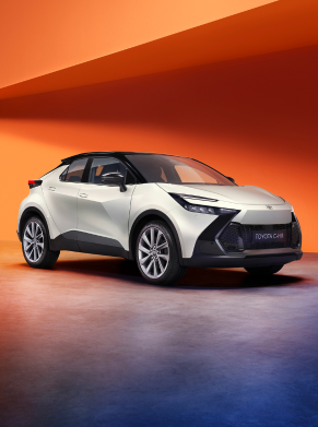 White Toyota C-HR viewed from the front and side, on display.