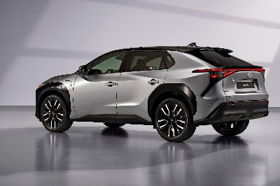 Silver SUV parked, side and rear view.