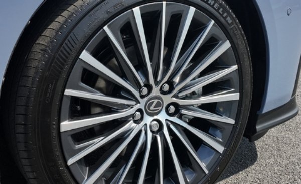 Close-up of a Lexus alloy wheel with multiple spokes and a visible tyre.
