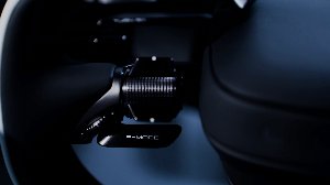 Close-up of a black adjustable dial labelled F-MODE.