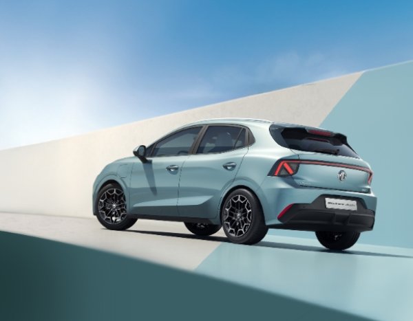 Light blue hatchback car shown from the rear and side, parked at an angle.