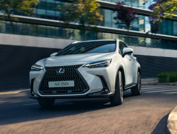 Silver Lexus NX 350h driving on a street.