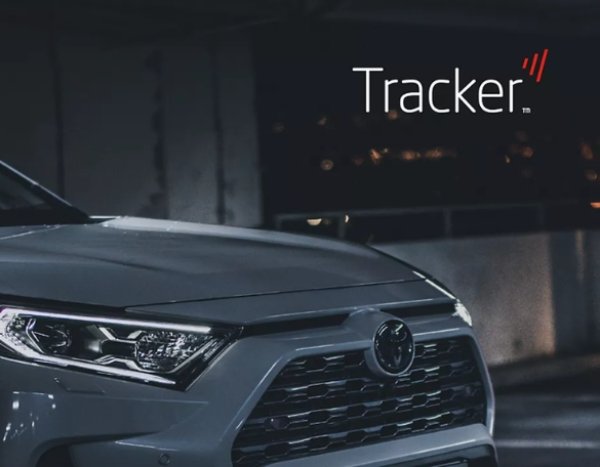Close-up of a grey car's front grille and headlights with Tracker logo above.
