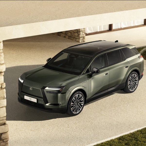Green Lexus TZ SUV parked in a driveway.